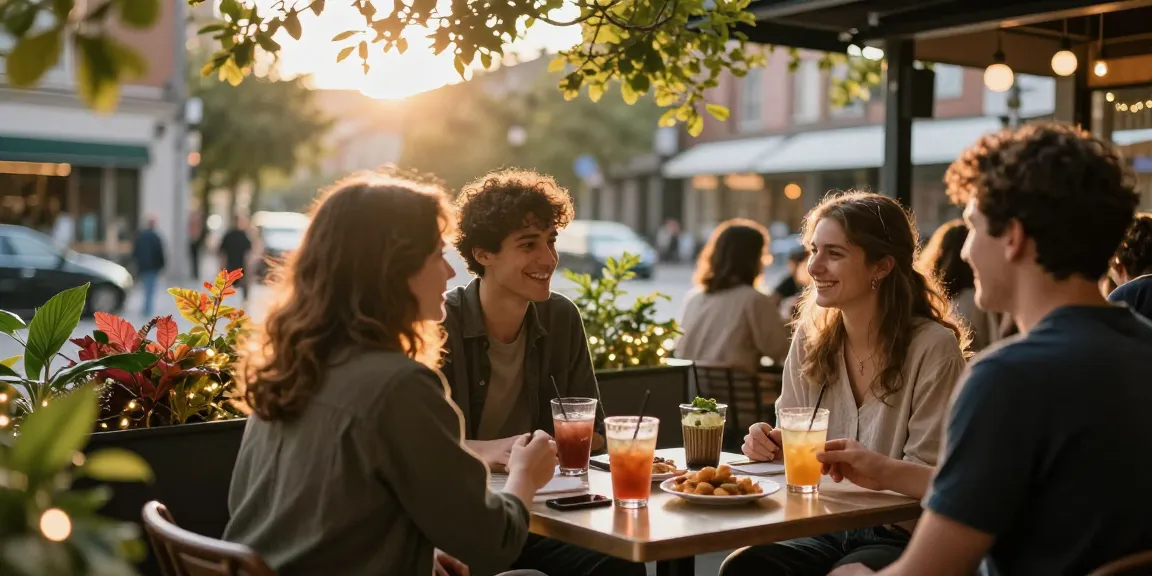 Friends enjoying drinks and snacks at a rokok88 café during golden hour, showcasing a lively social atmosphere.